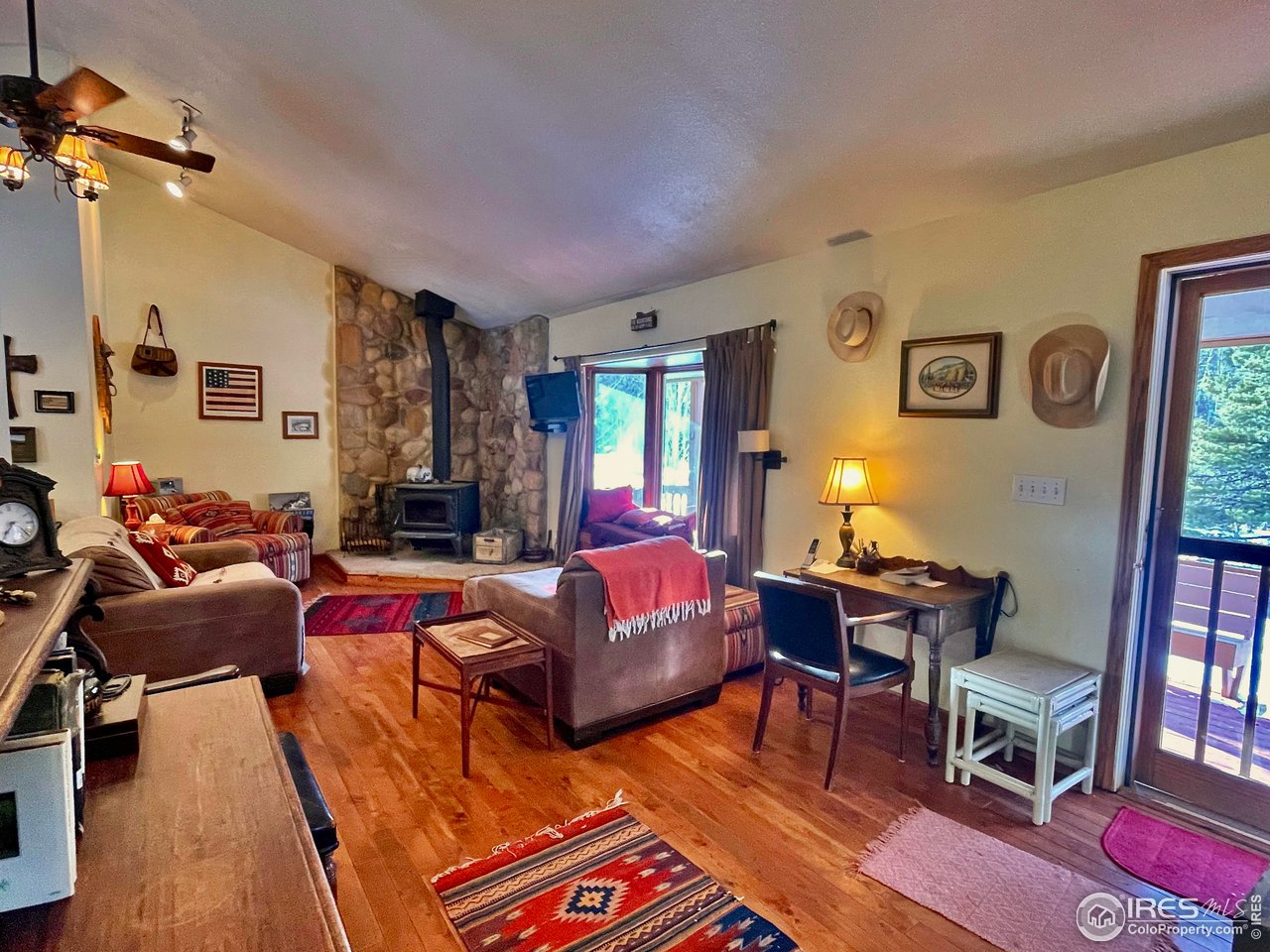 44 Riverside Lane Ward, CO 80481 - Photo 6 of 33 a living room with furniture a rug and a window