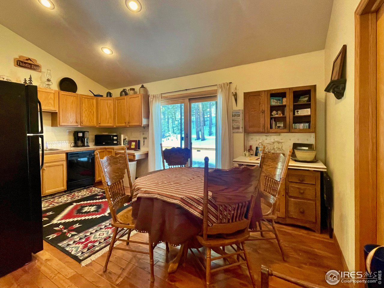 44 Riverside Lane Ward, CO 80481 - Photo 9 of 33 a view of a dining room with furniture window and wooden floor