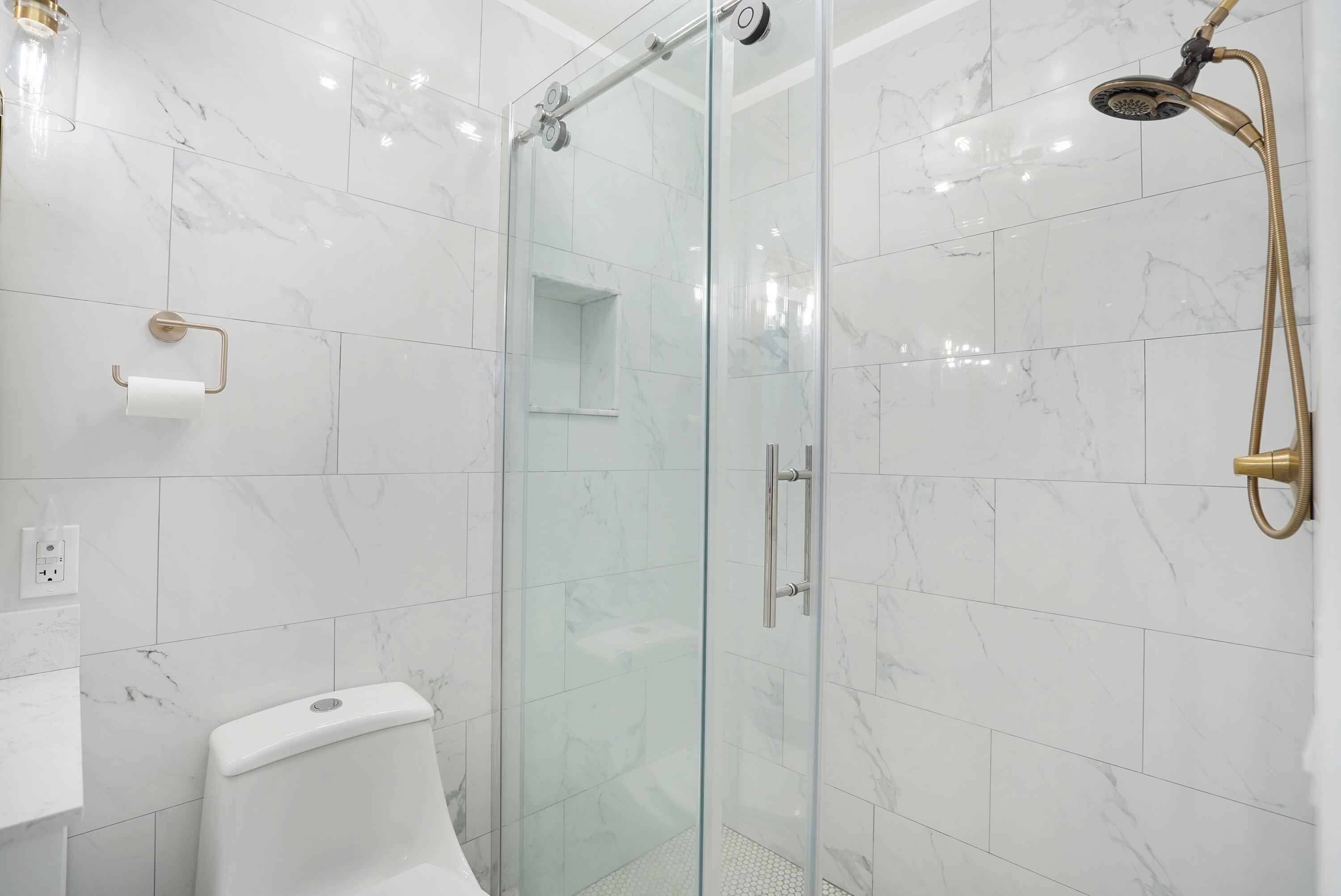 5100 Northeast 22nd Avenue Lighthouse Point, FL 33064 - Photo 6 of 31 a bathroom with a shower and toilet