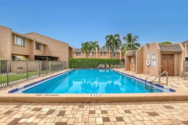 a view of swimming pool with outdoor seating and yard