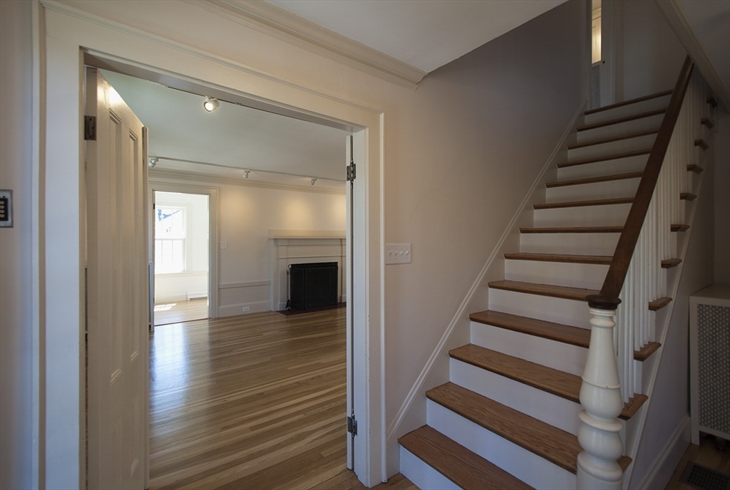 153 Watson Road Belmont, MA 02478 - Photo 7 of 20 a view of entryway and hall with wooden floor