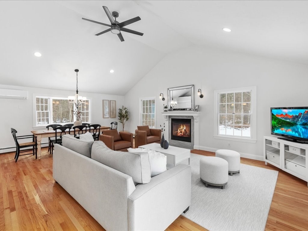 1 Scott Street Medfield, MA 02052 - Photo 12 of 42 a living room with furniture a fireplace and a flat screen tv