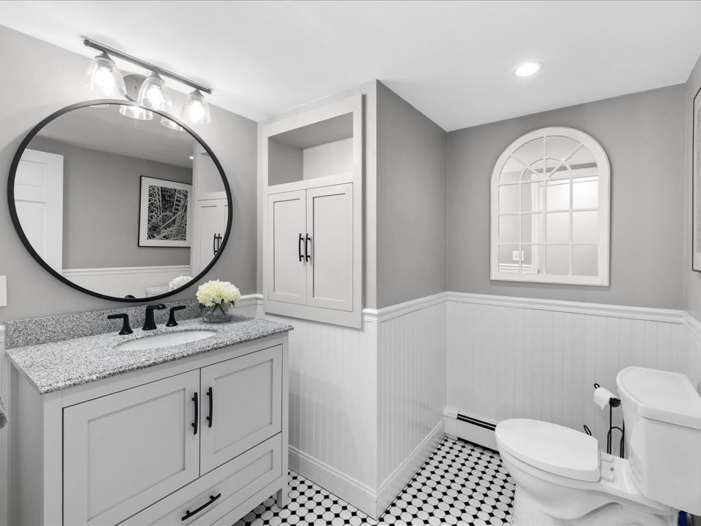 1 Scott Street Medfield, MA 02052 - Photo 20 of 42 a bathroom with a toilet a sink and mirror