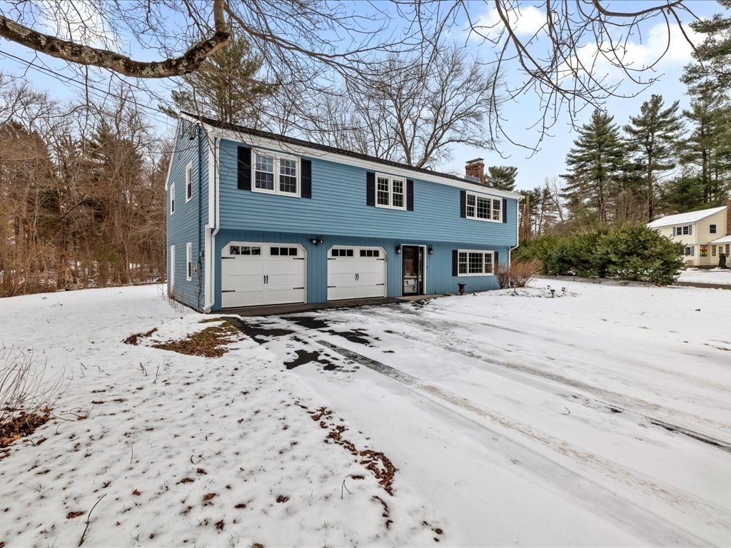 1 Scott Street Medfield, MA 02052 - Photo 2 of 42 a front view of a house with a yard covered in snow