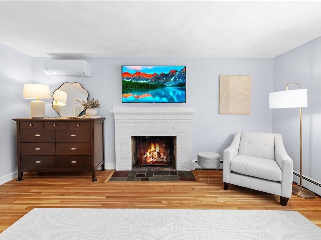 1 Scott Street Medfield, MA 02052 - Photo 24 of 42 a living room with furniture and a fireplace