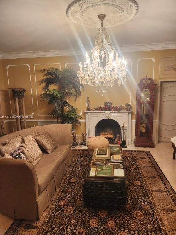 7945 Sunset Drive Miami, FL 33143 - Photo 11 of 28 a living room with furniture a chandelier and a fireplace
