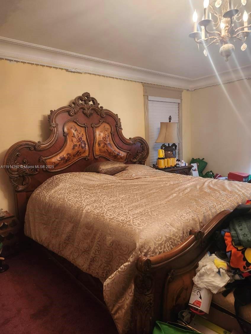 7945 Sunset Drive Miami, FL 33143 - Photo 13 of 28 a bedroom with a bed and a window