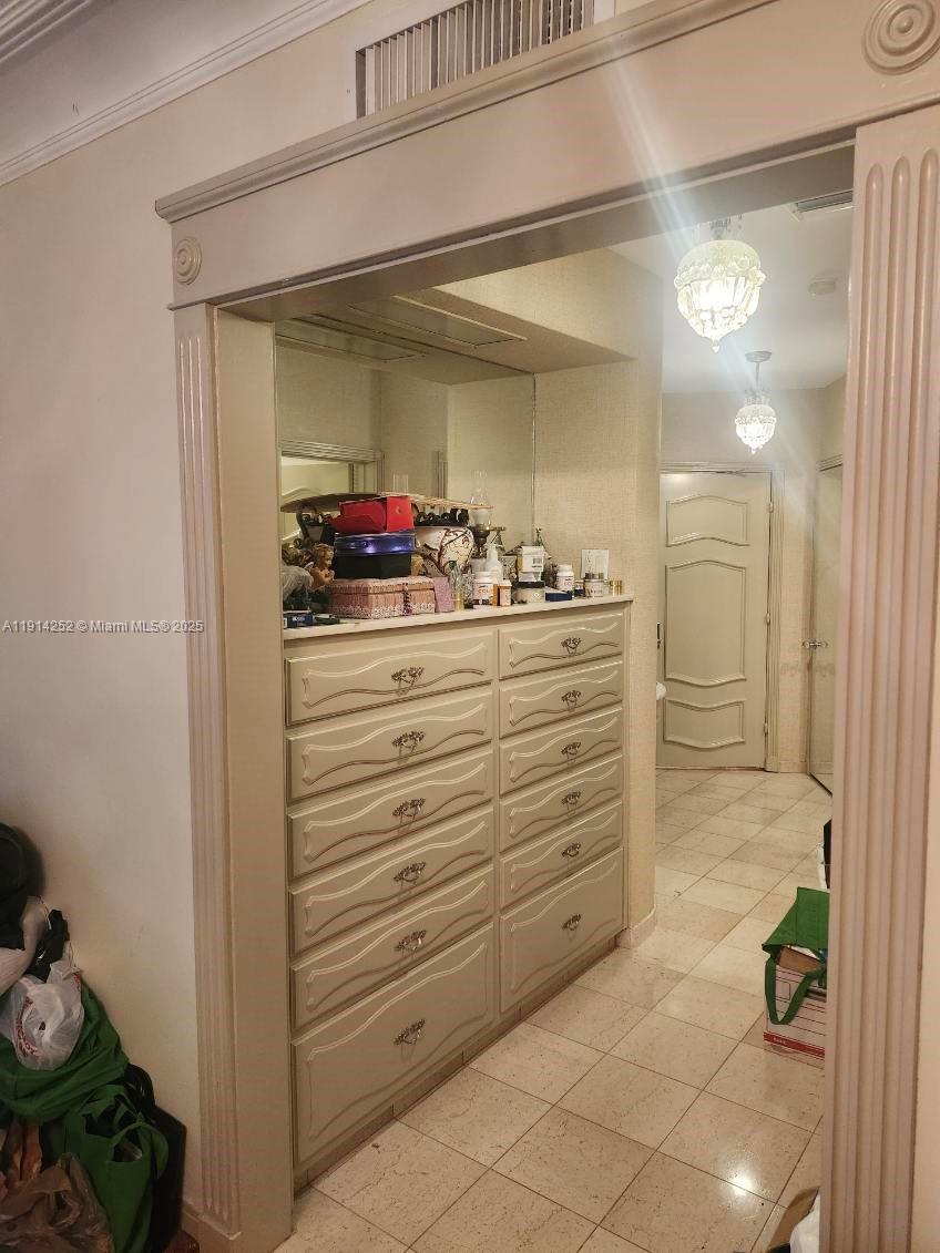 7945 Sunset Drive Miami, FL 33143 - Photo 14 of 28 a bathroom with a mirror vanity and shower