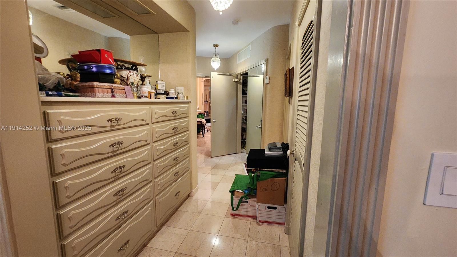 7945 Sunset Drive Miami, FL 33143 - Photo 15 of 28 a bathroom with a sink and a mirror