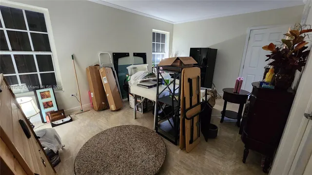 a view of a room with door and furniture