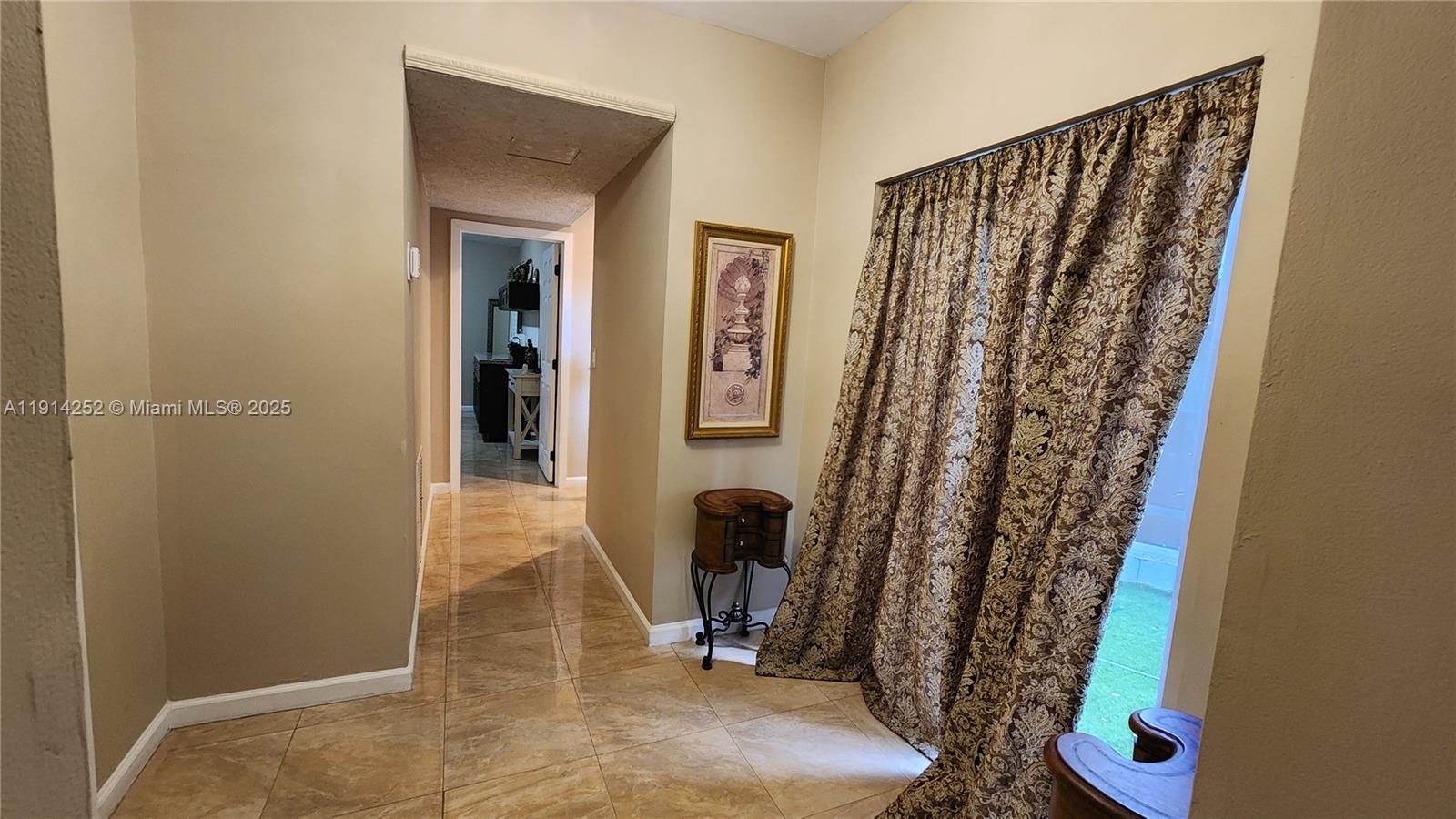 7945 Sunset Drive Miami, FL 33143 - Photo 19 of 28 a view of a room with door and furniture