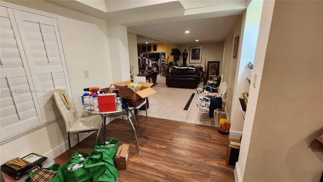 a kitchen with stainless steel appliances granite countertop a refrigerator and a stove