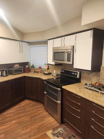 a bathroom with a shower and a glass door