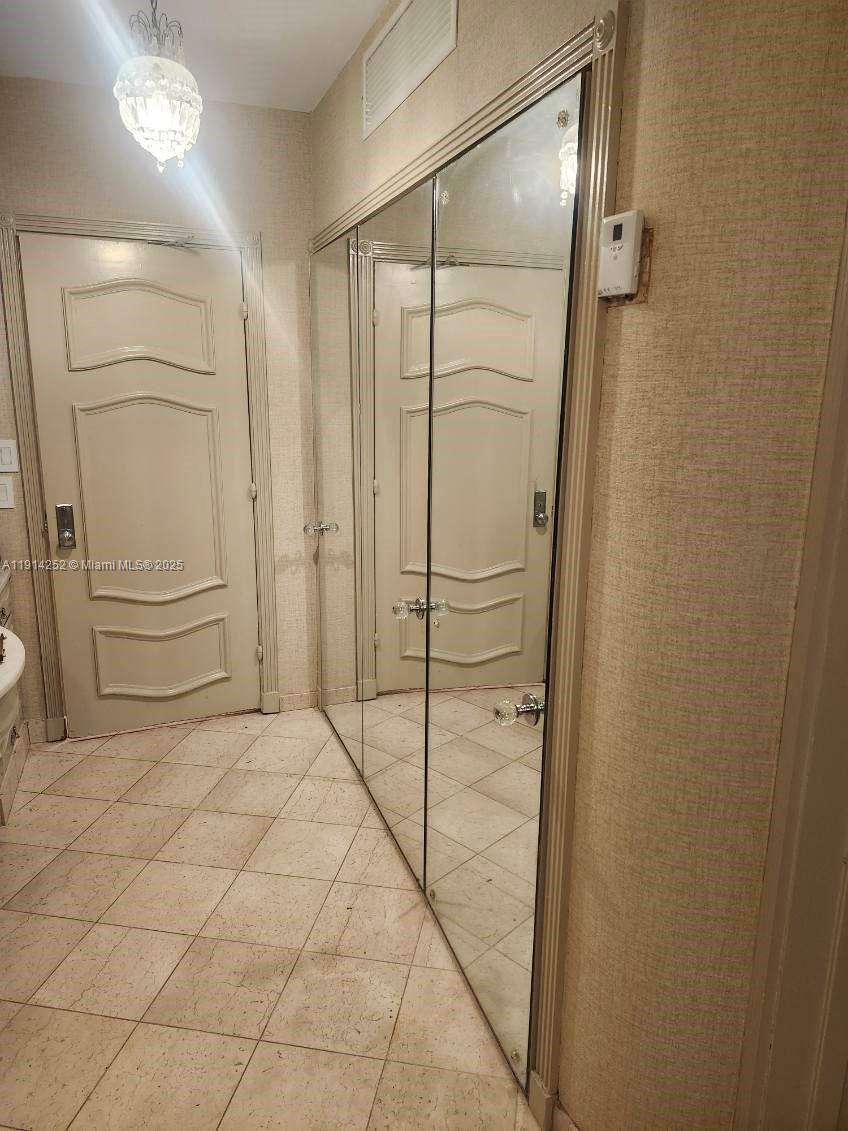7945 Sunset Drive Miami, FL 33143 - Photo 25 of 28 a bathroom with a shower and a glass door