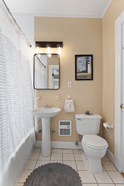 49-53 Appleton Street, Unit 7 Arlington, MA 02476 - Photo 14 of 21 a bathroom with a toilet a sink and mirror