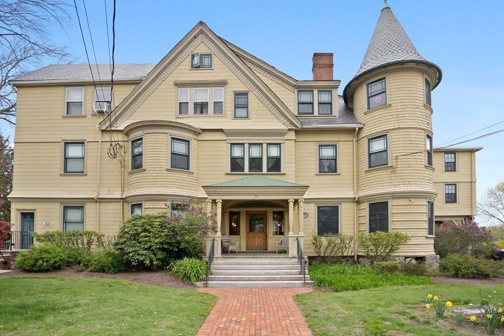 49-53 Appleton Street, Unit 7 Arlington, MA 02476 - Photo 19 of 21 a front view of a house with garden