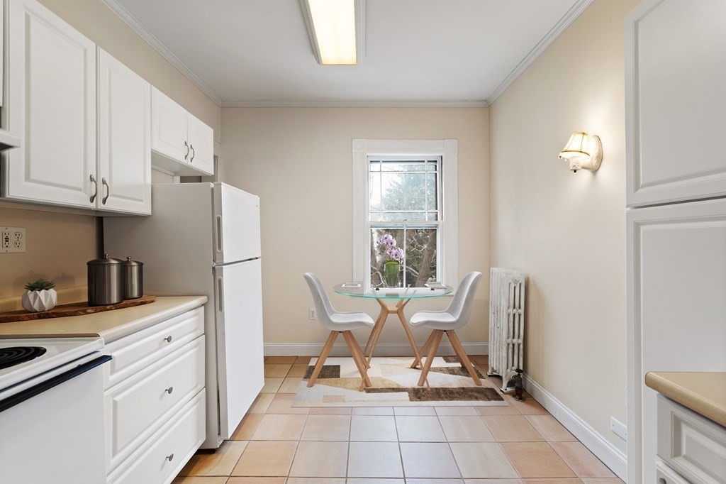 49-53 Appleton Street, Unit 7 Arlington, MA 02476 - Photo 6 of 21 a dining room with furniture and a window