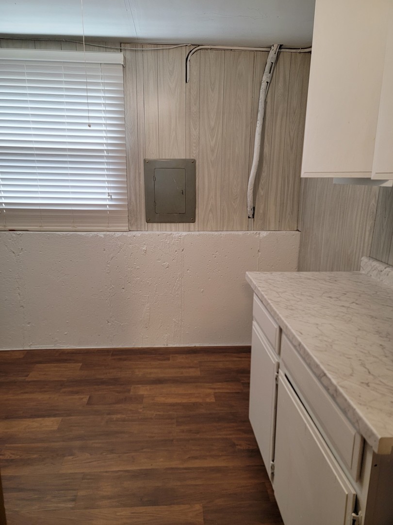 313 Dean Circle Bolingbrook, IL 60440 - Photo 14 of 15 a view of storage and utility room with wooden floor