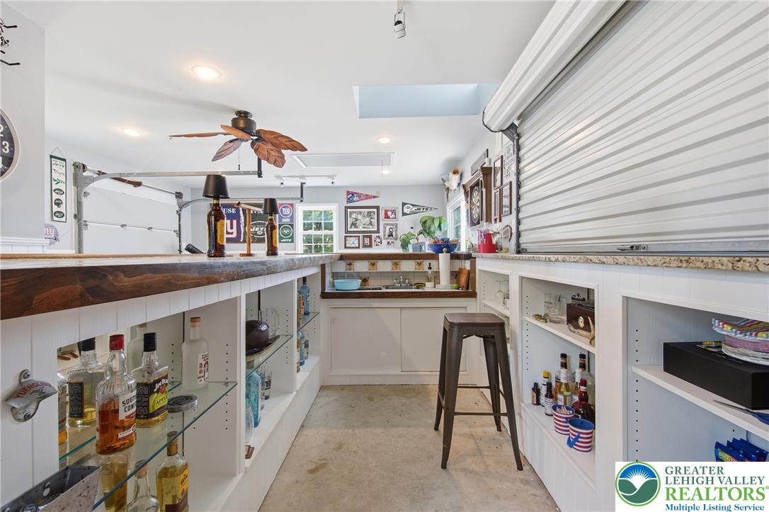 890 Lahr Road Nazareth, PA 18064 - Photo 41 of 71 A casual bar area with ample counter space and a built-in sink for effortless entertaining.