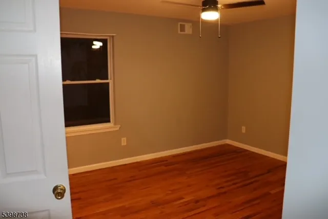 a view of a small space with wooden floor