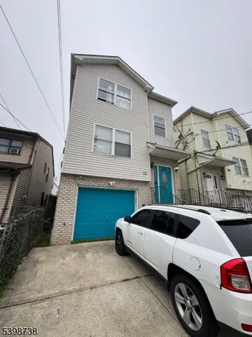 a front view of a house with parking