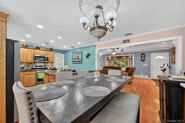 a bathroom with a granite countertop shower a sink and a large mirror