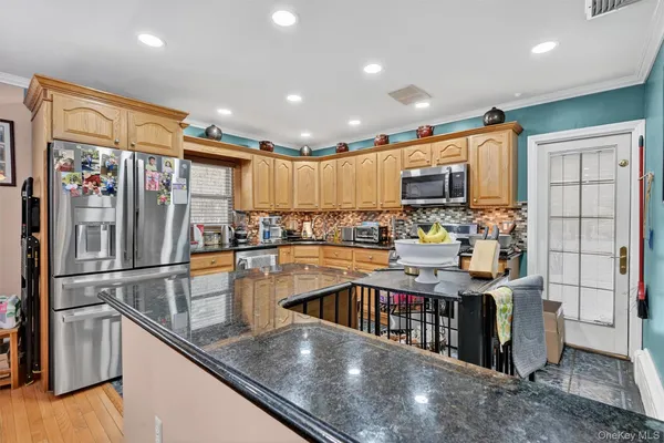 a bedroom with furniture and a large window