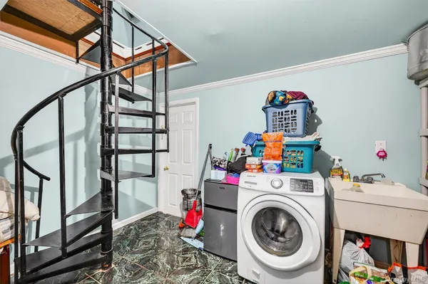 a front view of a house with a yard and tree s