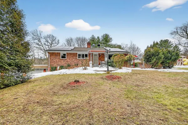 a view of a backyard of the house