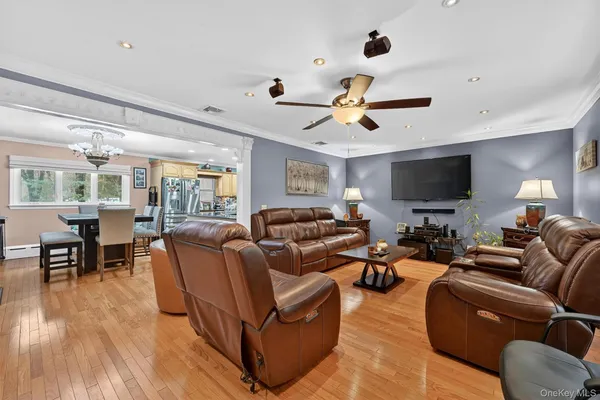 a kitchen with stainless steel appliances granite countertop a sink a stove top oven a counter space and cabinets