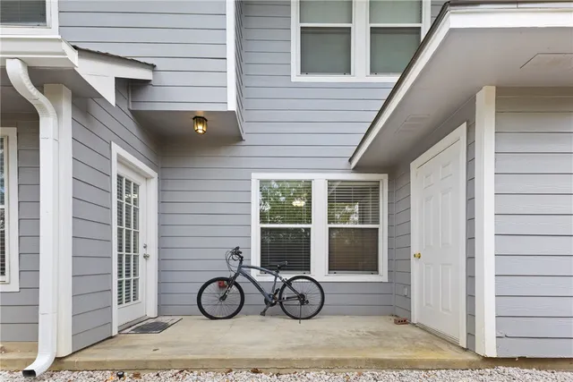 a picture of a bench in front of a wall