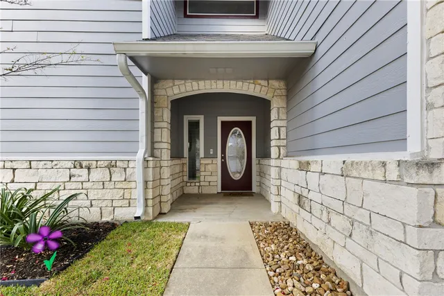 a view of entryway with wooden floor and stairs