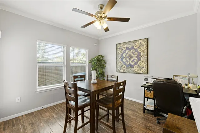 a kitchen with a sink a refrigerator a window and cabinets
