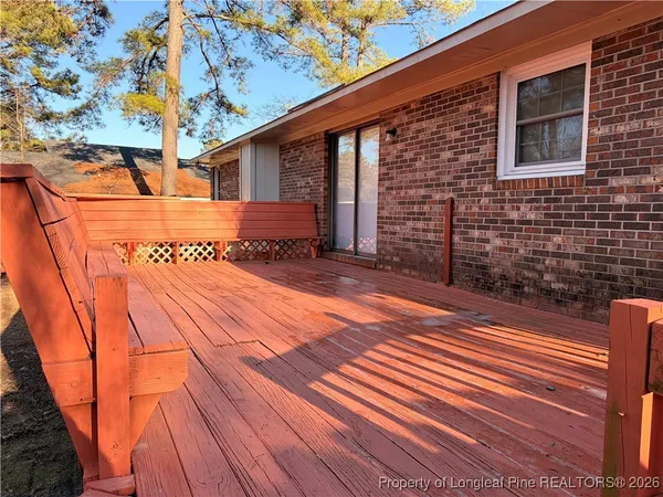 a view of a house with a yard and a patio