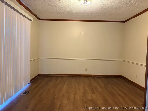 a kitchen with stainless steel appliances a refrigerator stove and microwave