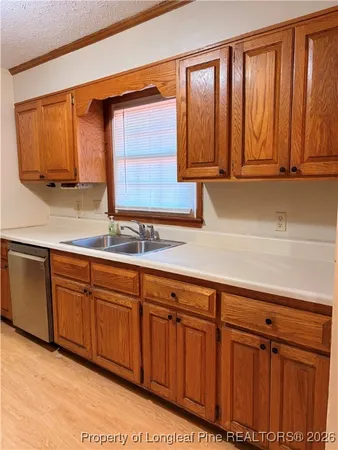 a kitchen with stainless steel appliances granite countertop a refrigerator stove and microwave