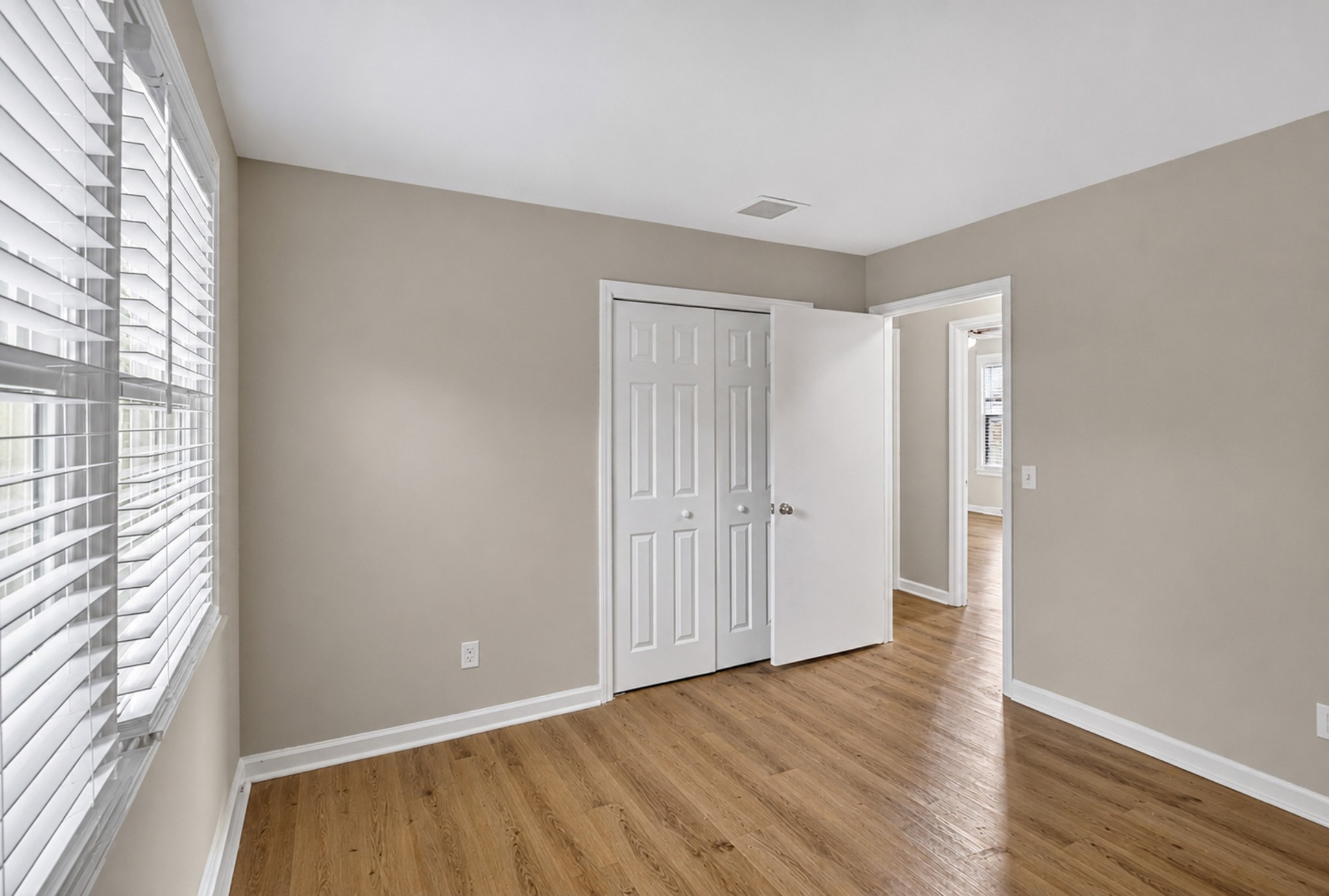 489 Canton Pass Madison, TN 37115 - Photo 17 of 25 a view of an empty room with wooden floor and a window