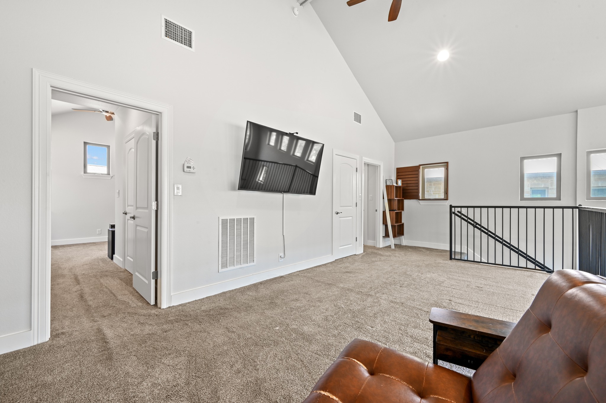 592 Farm To Market 967, Unit B Buda, TX 78610 - Photo 18 of 26 The spacious upstairs layout offers the perfect balance of openness and privacy, with generously sized bedrooms tucked away from the versatile loft area.