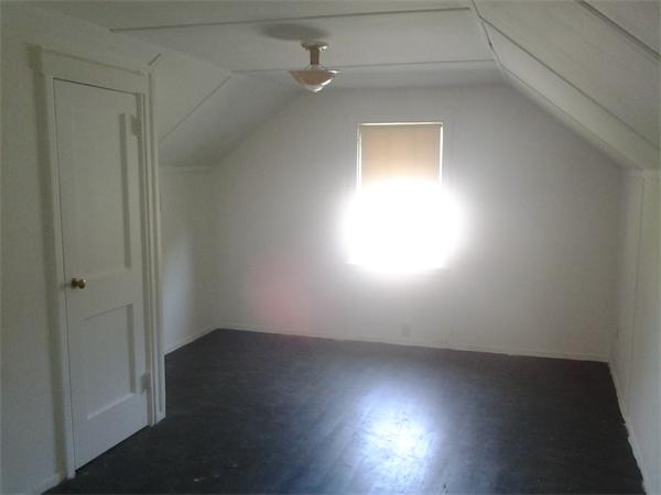 161 Mayflower Road Springfield, MA 01118 - Photo 13 of 20 an empty room with wooden floor and windows