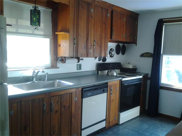 161 Mayflower Road Springfield, MA 01118 - Photo 3 of 20 a kitchen with a sink stove and cabinets