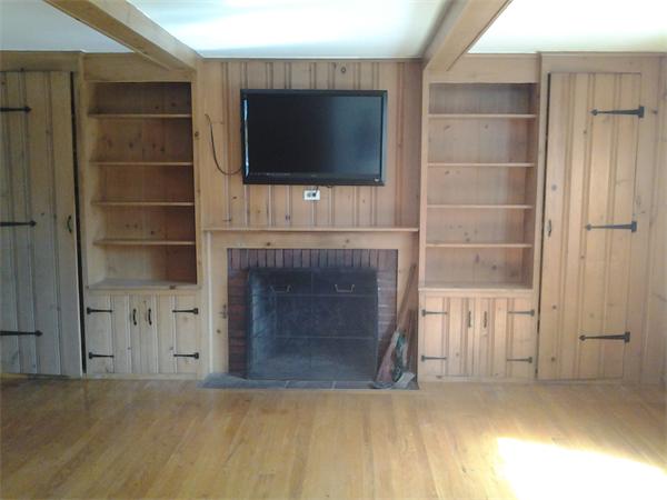 161 Mayflower Road Springfield, MA 01118 - Photo 5 of 20 a living room with a fireplace and a flat screen tv