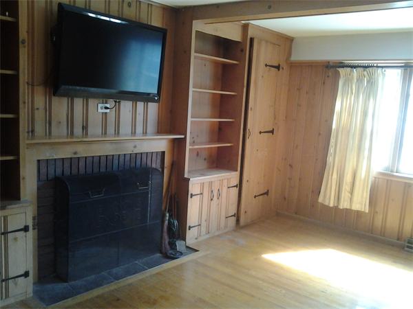 161 Mayflower Road Springfield, MA 01118 - Photo 6 of 20 a living room with a fireplace and a flat screen tv