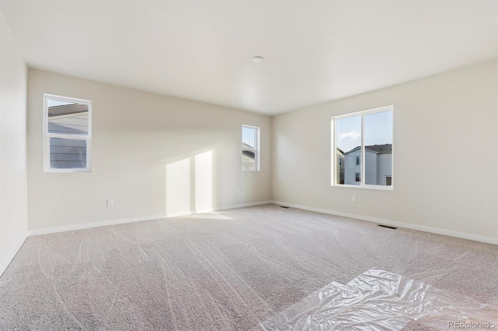 1430 Farmstead Street Brighton, CO 80601 - Photo 21 of 24 a view of an empty room with a window