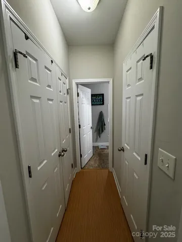 a bathroom with double vanity sink a mirror and shower