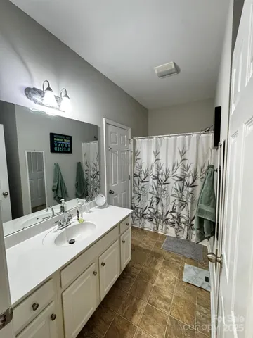 a kitchen with stainless steel appliances granite countertop a stove a sink dishwasher and a microwave oven with cabinets