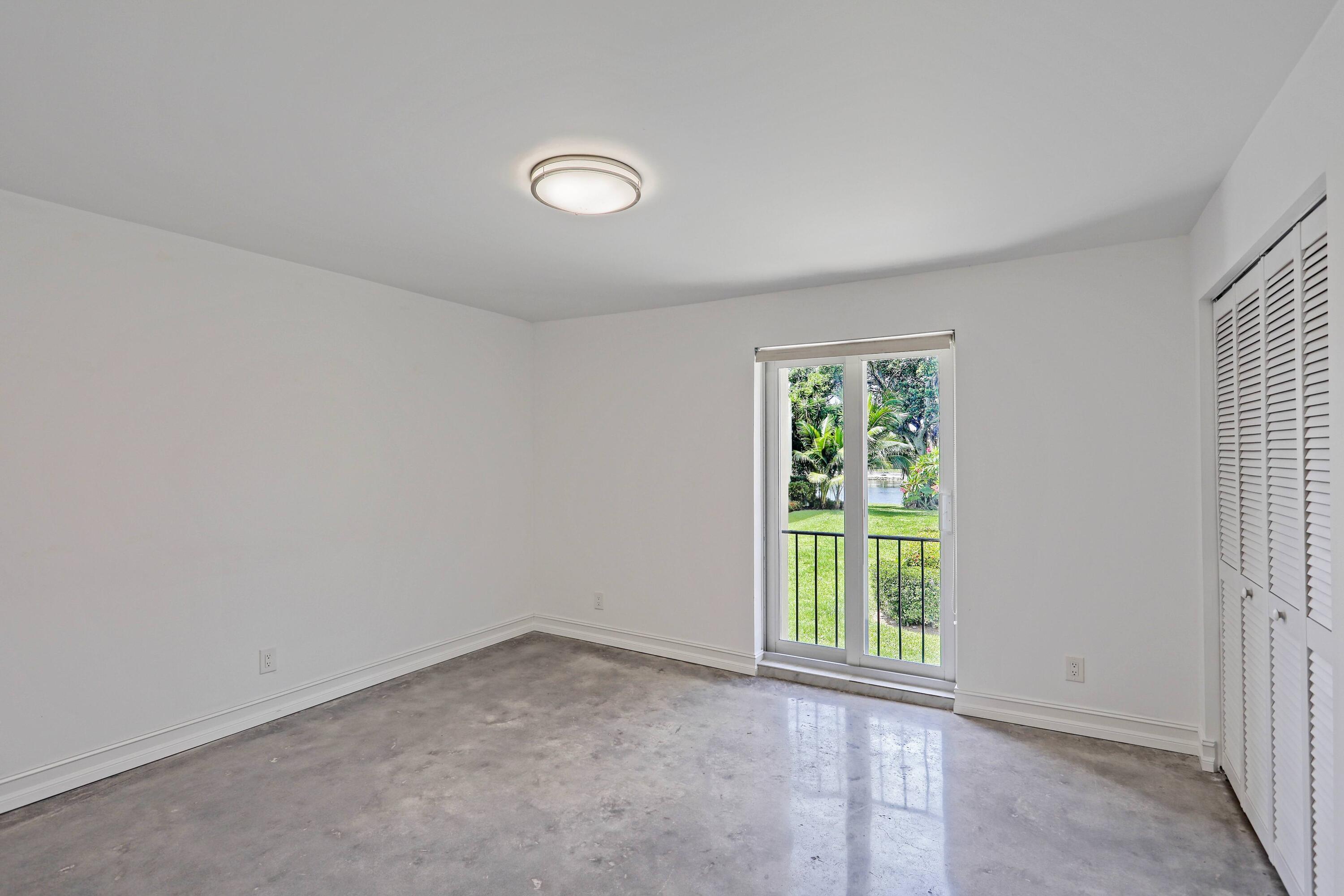 394 Golfview Road, Unit F North Palm Beach, FL 33408 - Photo 23 of 73 an empty room with a window