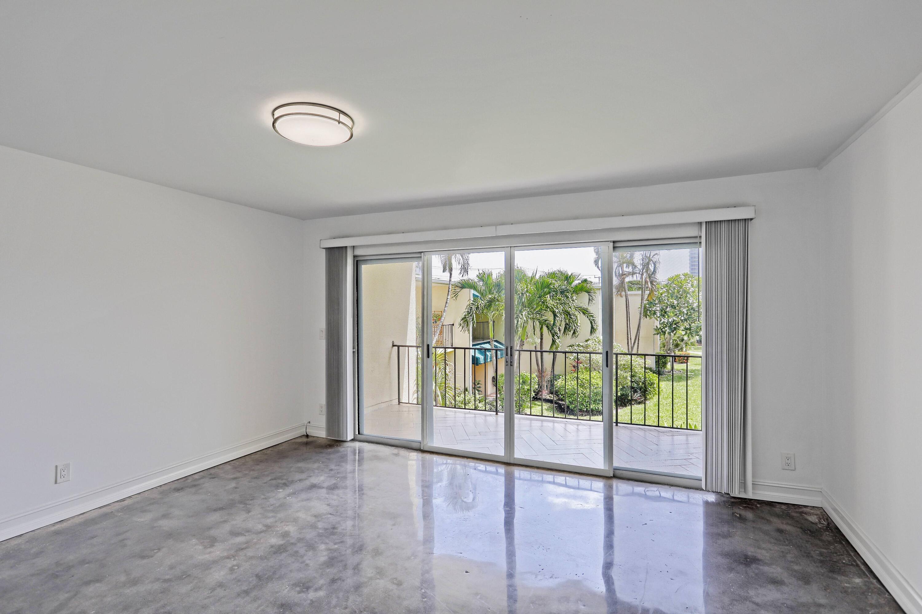 394 Golfview Road, Unit F North Palm Beach, FL 33408 - Photo 29 of 73 a view of an empty room and window
