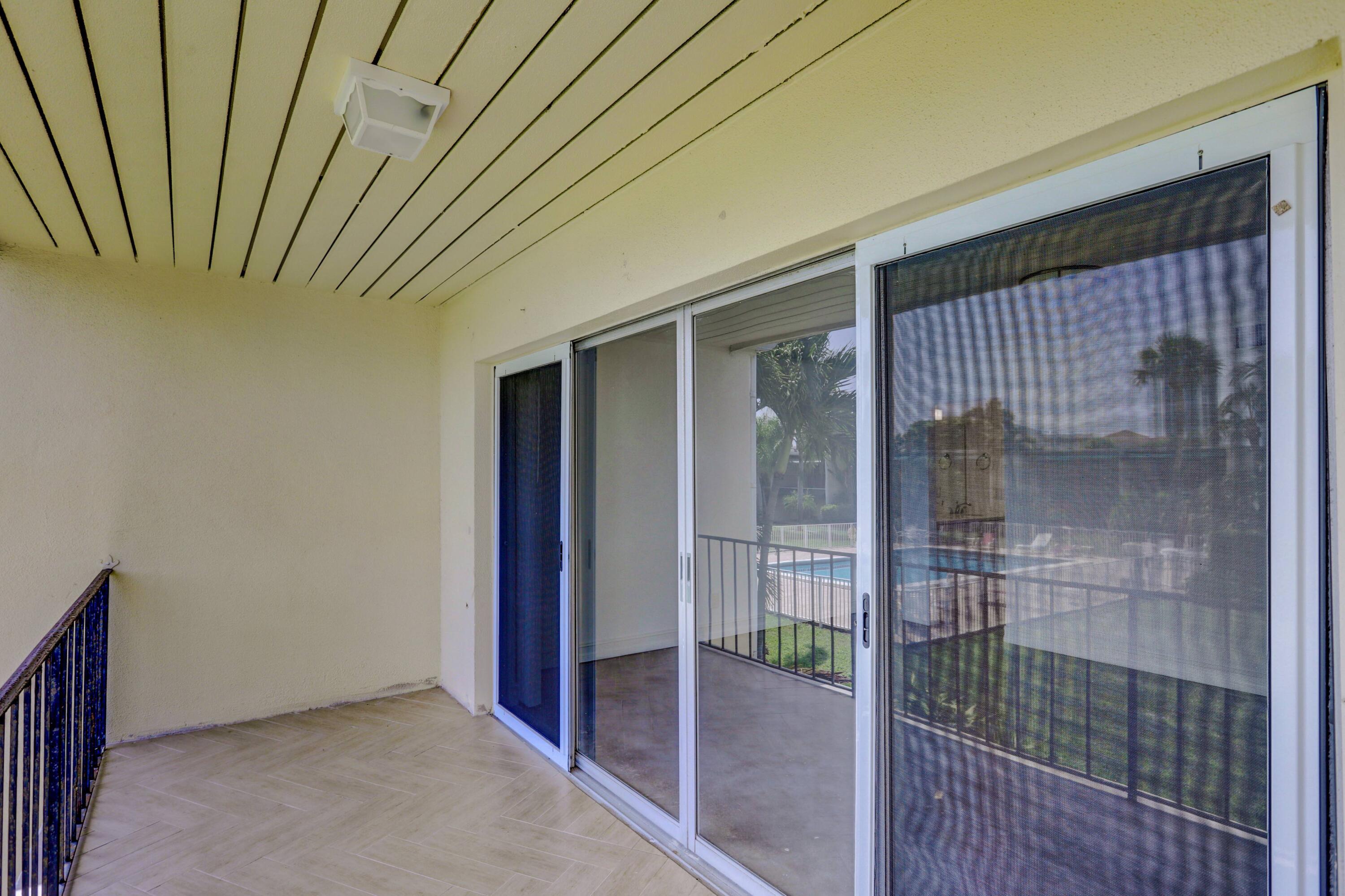 394 Golfview Road, Unit F North Palm Beach, FL 33408 - Photo 35 of 73 a view of a room with wooden walls
