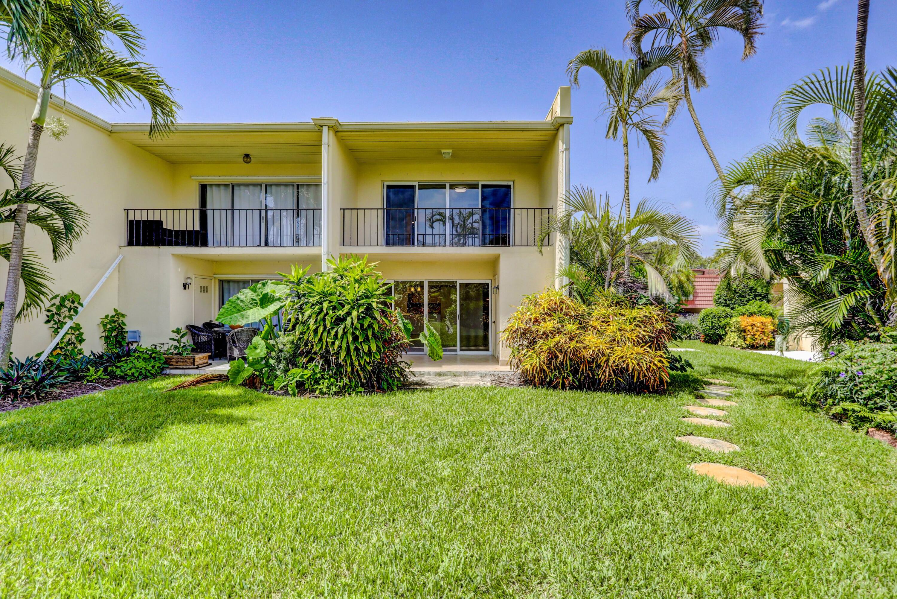 394 Golfview Road, Unit F North Palm Beach, FL 33408 - Photo 43 of 73 a view of a house with a yard