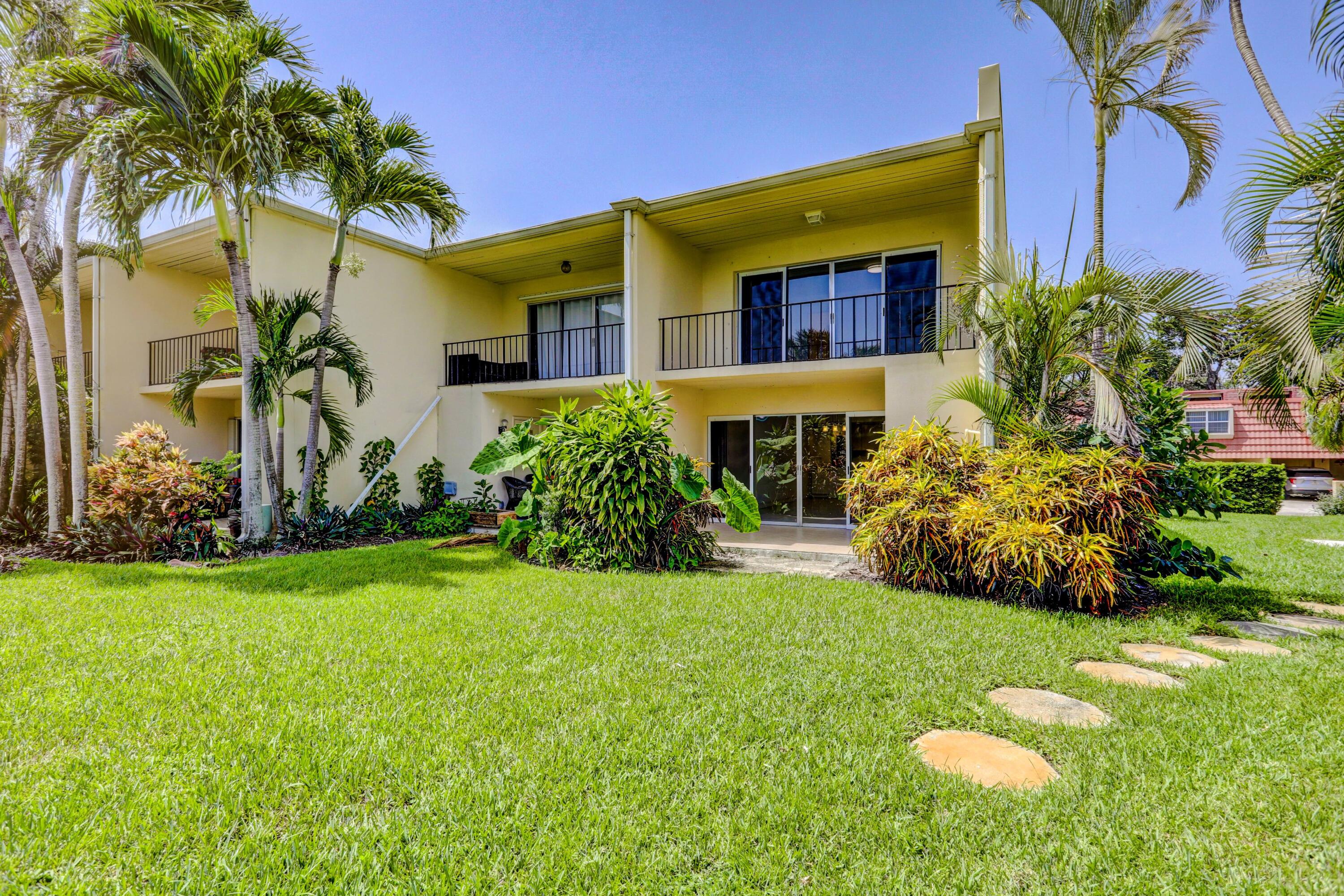 394 Golfview Road, Unit F North Palm Beach, FL 33408 - Photo 44 of 73 a front view of a house with garden